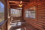 screened in porch with great porch swing